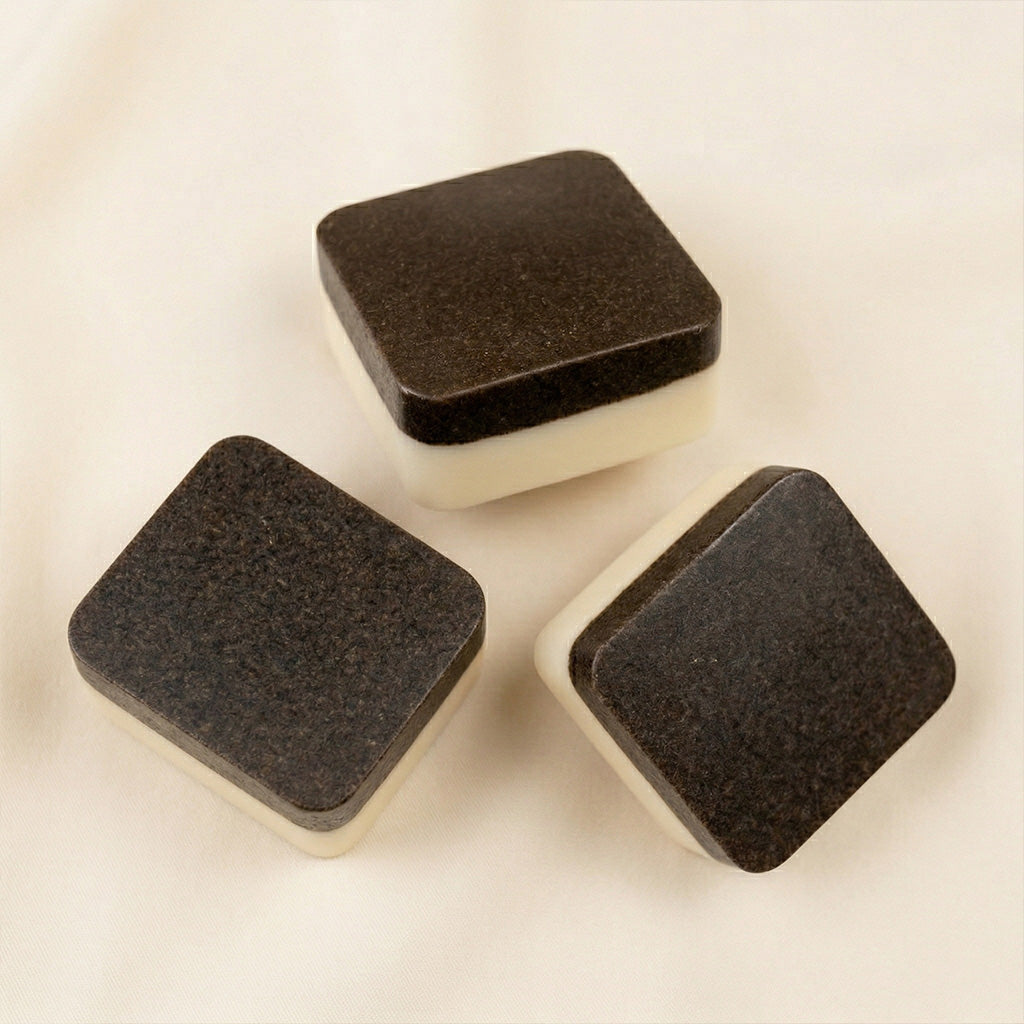 Collection of 2nd Ground upcycled coffee soap bars on a stone surface with branded boxes. comfrey salve for healing arthritis workout recovery drawing salve