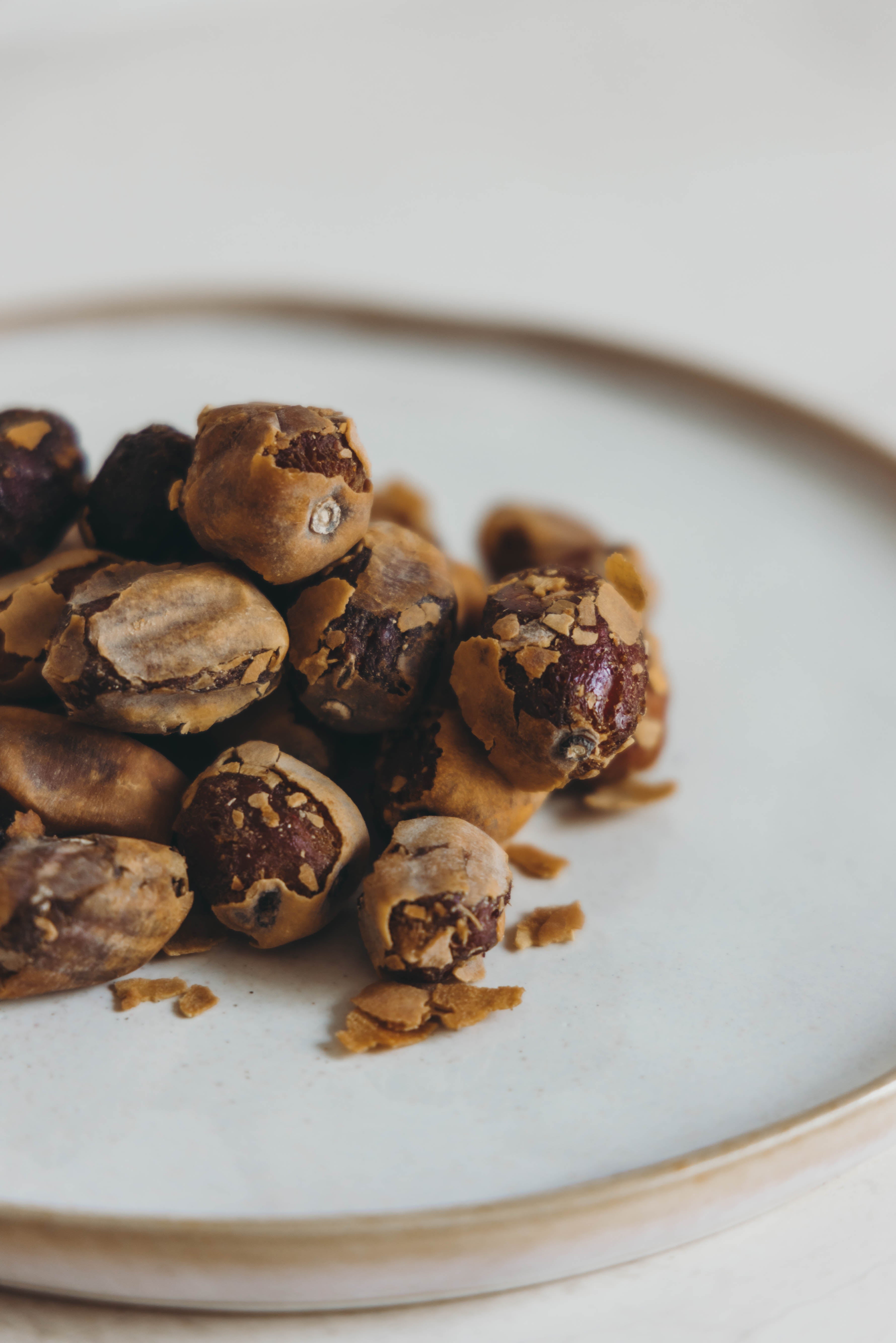 Peanuts on a white plate with a blurred background. This herbal support gives the body a total detox by:
Helping purge waste, toxins, and poisons from the system
Relieving constipation
Reducing candida in the body
Is known to help rid the body of worms and parasites
Increasing iron absorption
Lowering inflammation
Promoting healthy skin