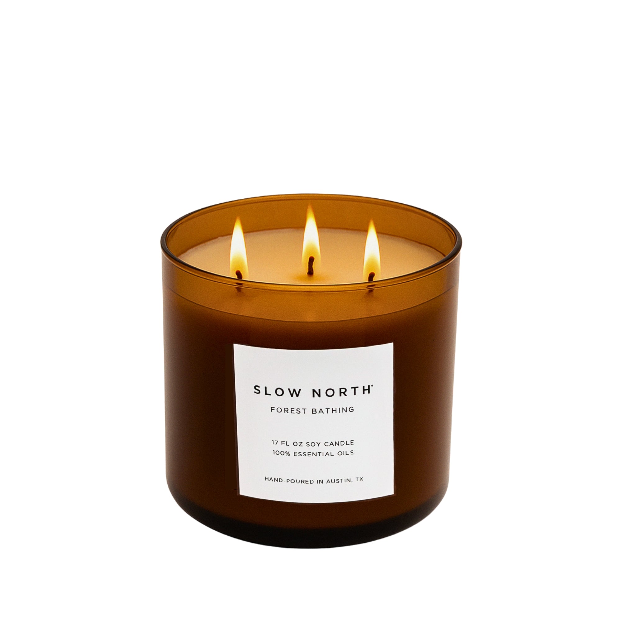 Brown candle with three flames and a white label on a white background.
Hand-poured in Austin, Texas, this candle is made with 100% soy wax and pure essential oils