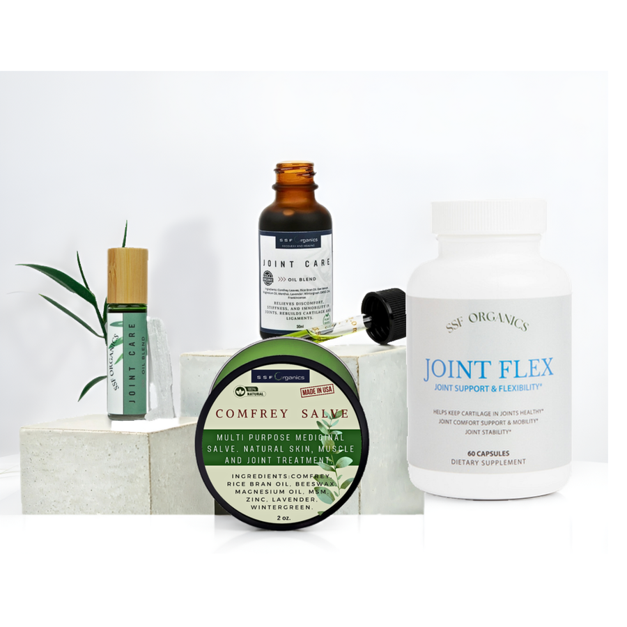 A wellness product bundle on a white background featuring a white bottle of Joint Flex by Nutri Organics, a green and white tin of Comfrey Salve, an amber glass bottle of Joint Care, a green roll-on bottle, and a small green plant sprig.