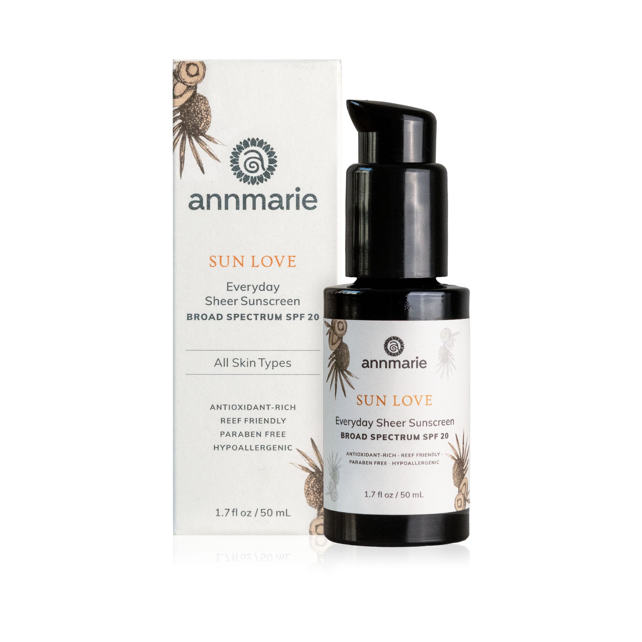 Annmarie Sun Love sunscreen bottle with ingredients listed on a white background. Hand holding a bottle of 'Sun Love' sunscreen with green foliage in the background. natural skin face sunscreen. comfrey and arnica tallow