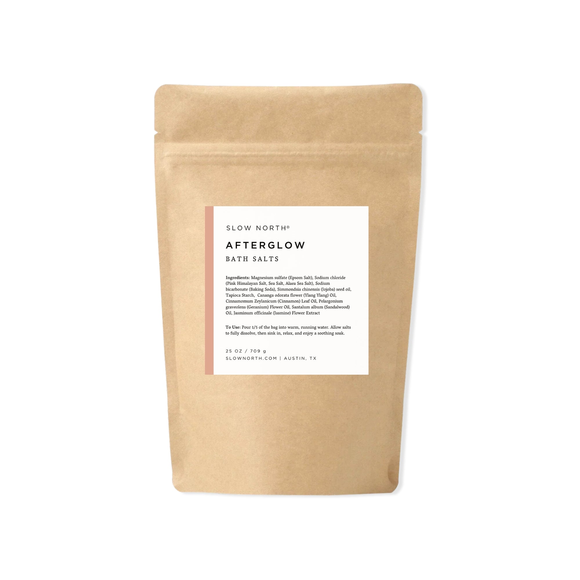 Kraft paper packaging of 'Afterglow' bath salts with a white label on a white background. essential oils epsom salt bath soak