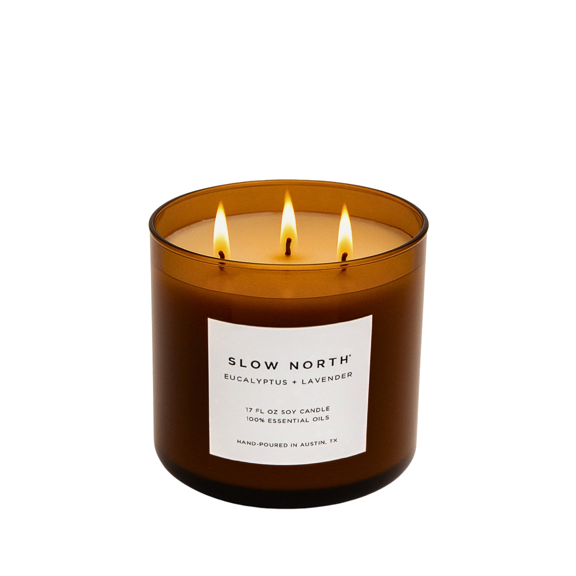 Three-wick candle in a brown glass jar with a label on a white background. Transform your space into a serene retreat with our new&nbsp;Signature 3-Wick Candle in&nbsp;Eucalyptus + Lavender&nbsp;— a sweet, calming blend designed to fill larger spaces with soft, natural fragrance and a warm, even glow. Topped with a black metal lid.

Hand-poured in Austin, Texas, this candle is crafted with 100% soy wax and pure essential oils, offering a clean, non-toxic burn you can feel good about.