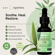 SSF Organics Comfrey Oil bottle with dropper on a light background with green leaves.