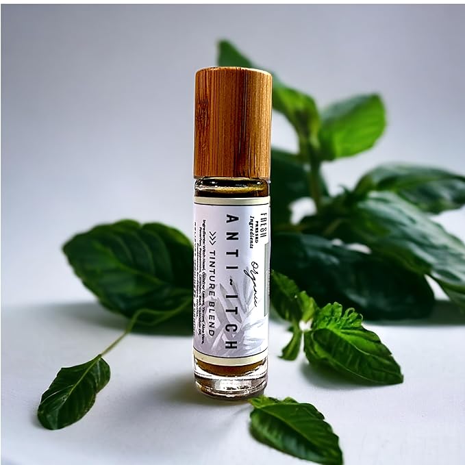 Anti-Itch Tincture Blend bottle with a white label and wood-tone cap, surrounded by green leaves