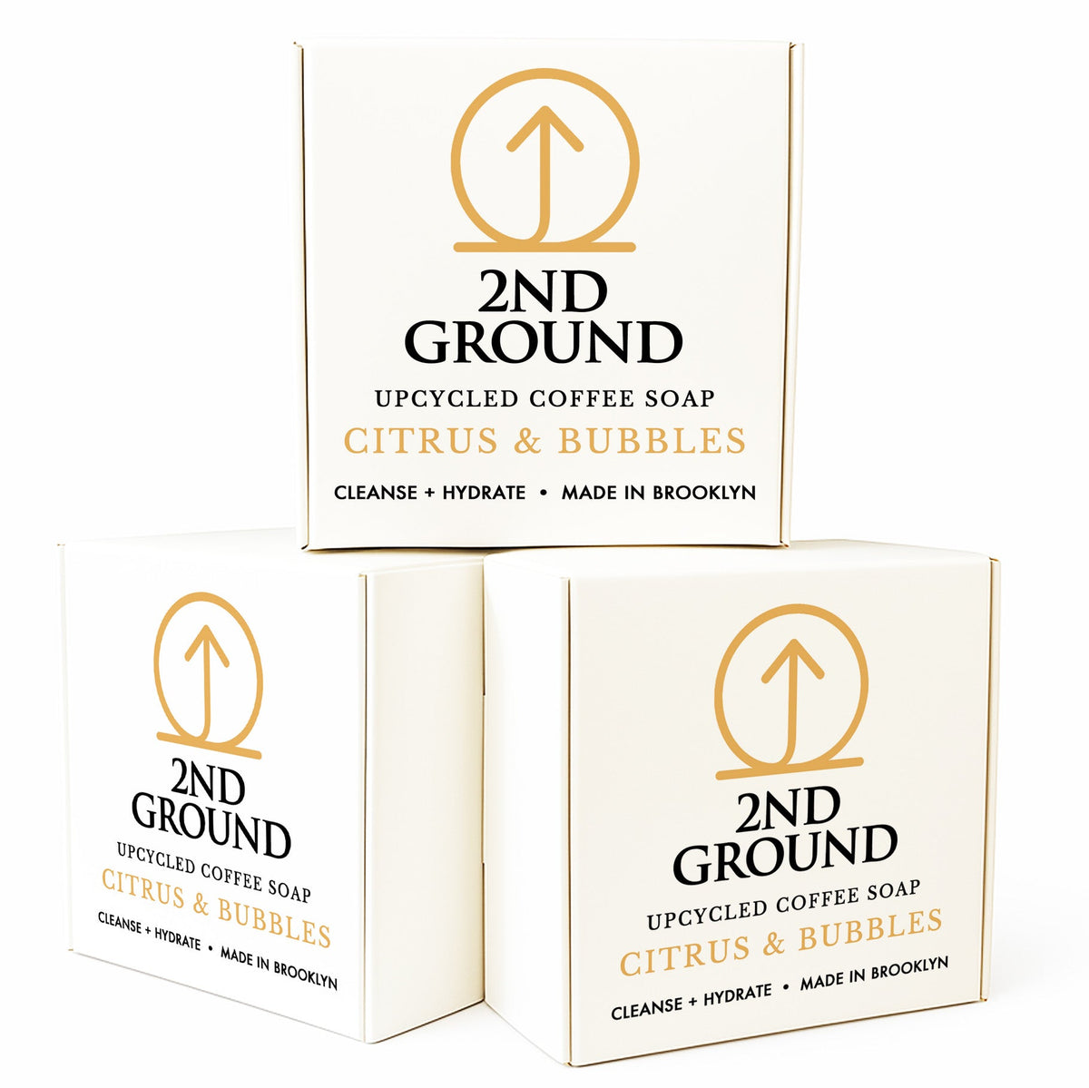 Three boxes of 2nd Ground upcycled coffee soap with Citrus & Bubbles scent on a white background. Collection of 2nd Ground upcycled coffee soap bars on a stone surface with branded boxes. comfrey salve for healing arthritis workout recovery drawing salve