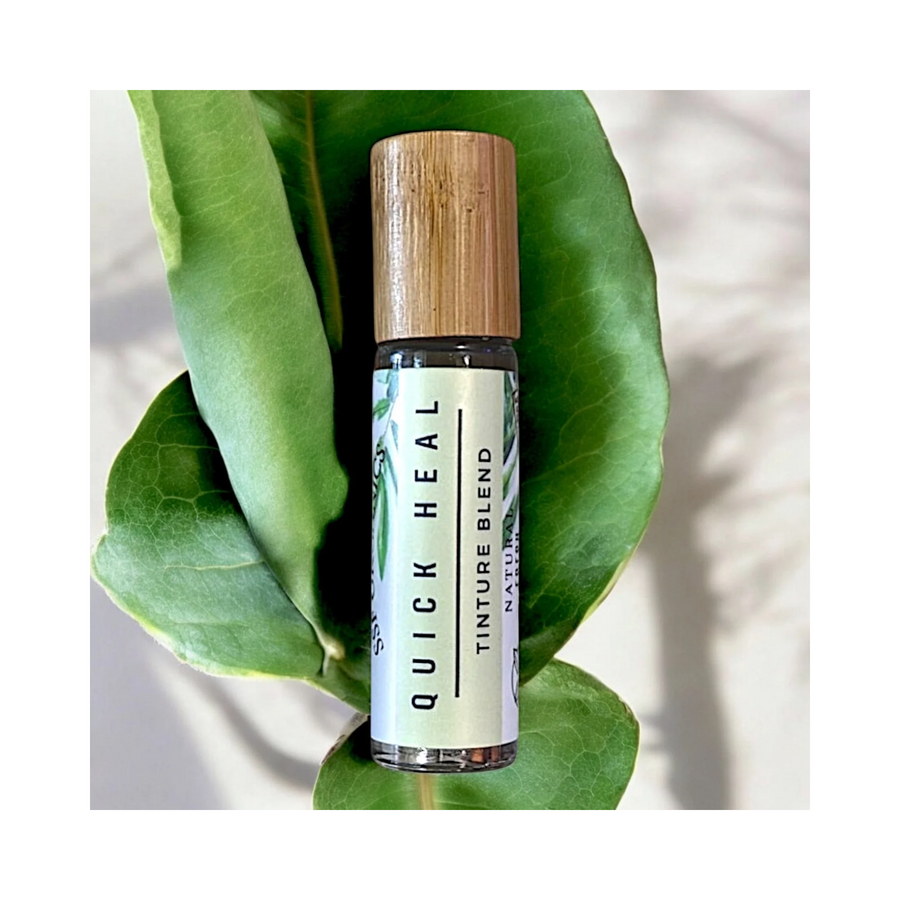 SSF Organics Quick Heal Tincture Blend bottle with a wood-grain cap on a white background. comfrey aloe and helichrysum for scars